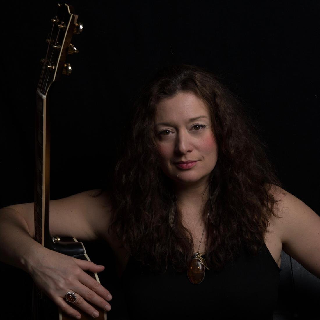 Lindsay May with her guitar